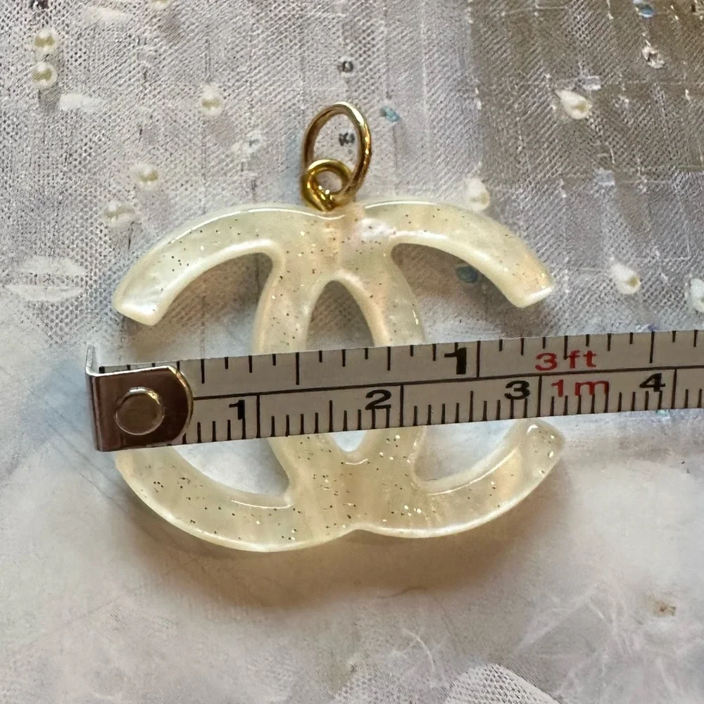 CHANEL Acrylic with Gold Flecks Zipper Pull Charm